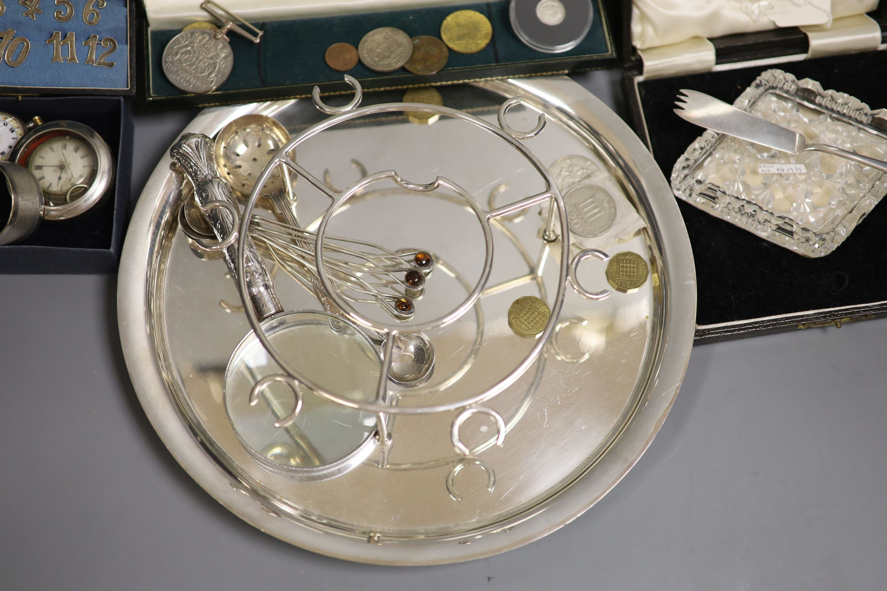 A plated silver stand, a fob watch, coins etc.